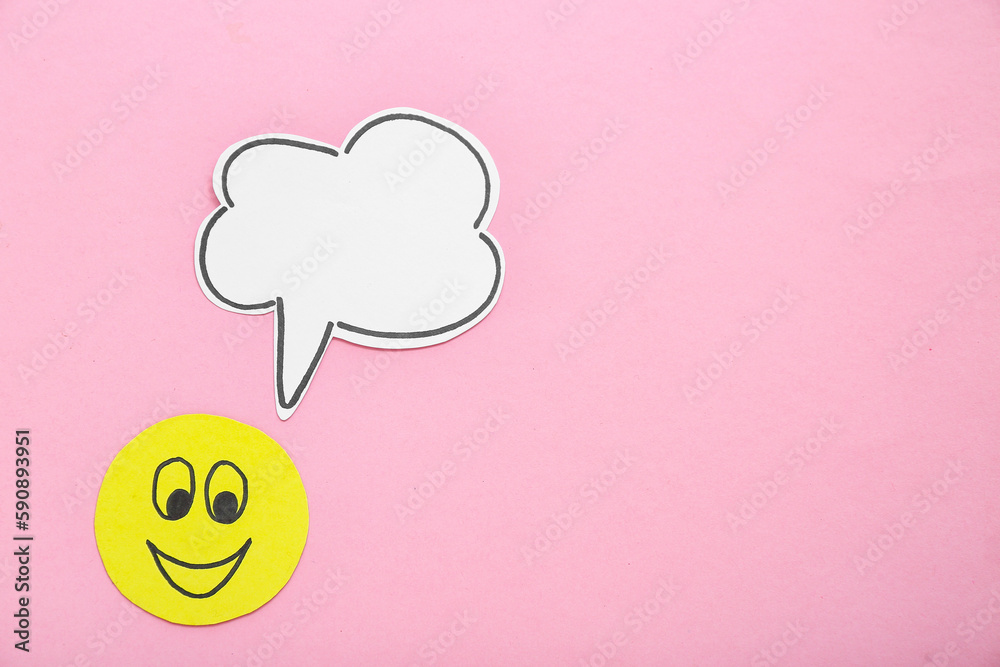 Paper smile with speech bubble on pink background. Dialogue concept