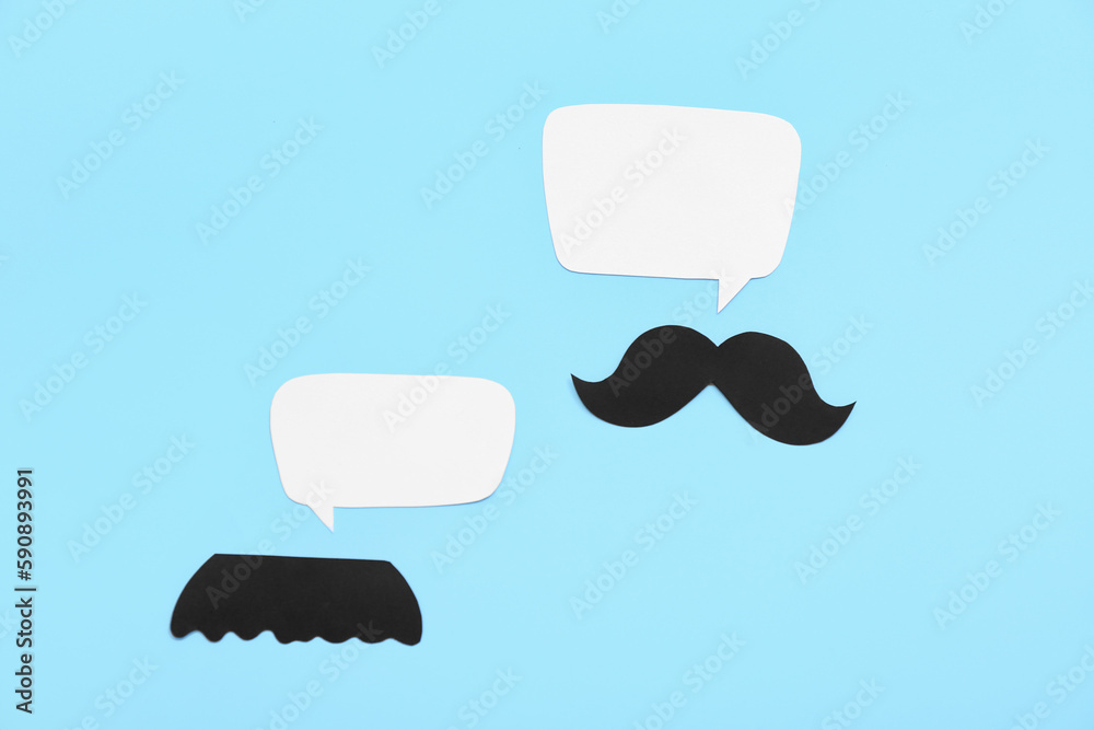 Paper mustaches with speech bubbles on blue background. Dialogue concept