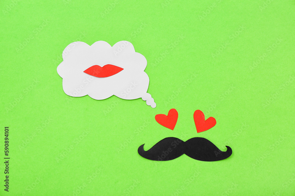 Paper male face and speech bubble with lips on green background. Dialogue concept