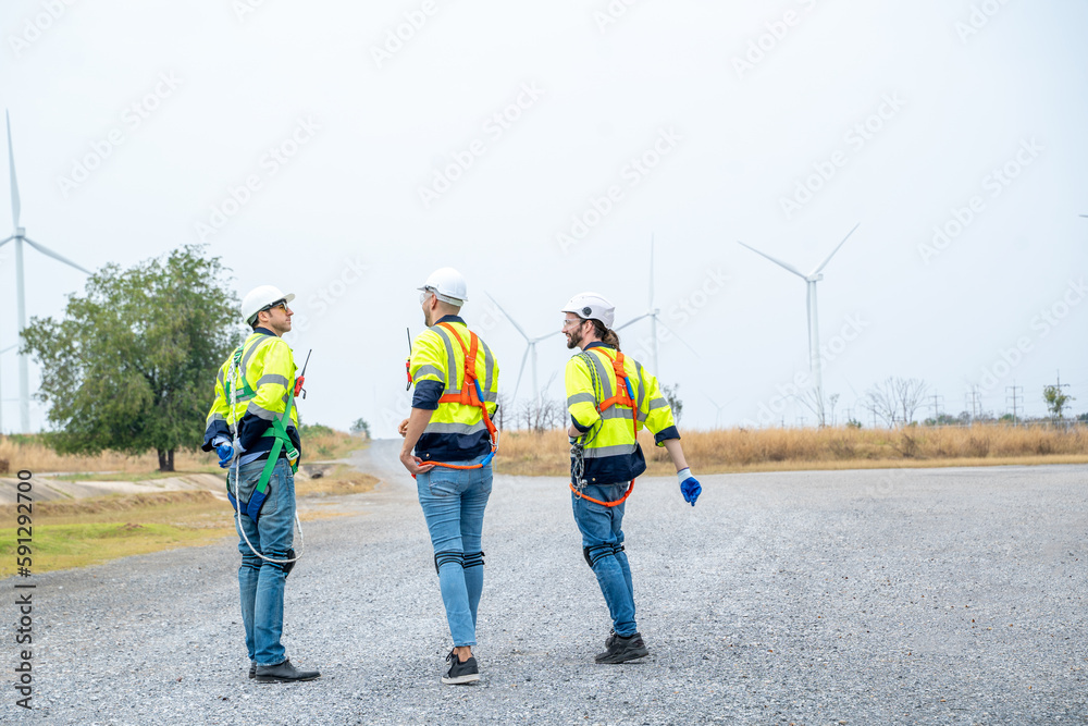 Engineer inspection wind power plants with check performance,Clean energy concept saves the world.