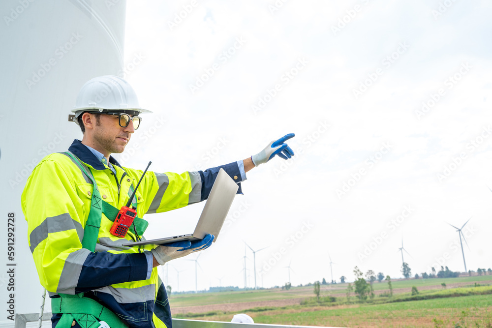 Engineer working at the natural energy wind turbine site,Wind turbine operations that transform wind