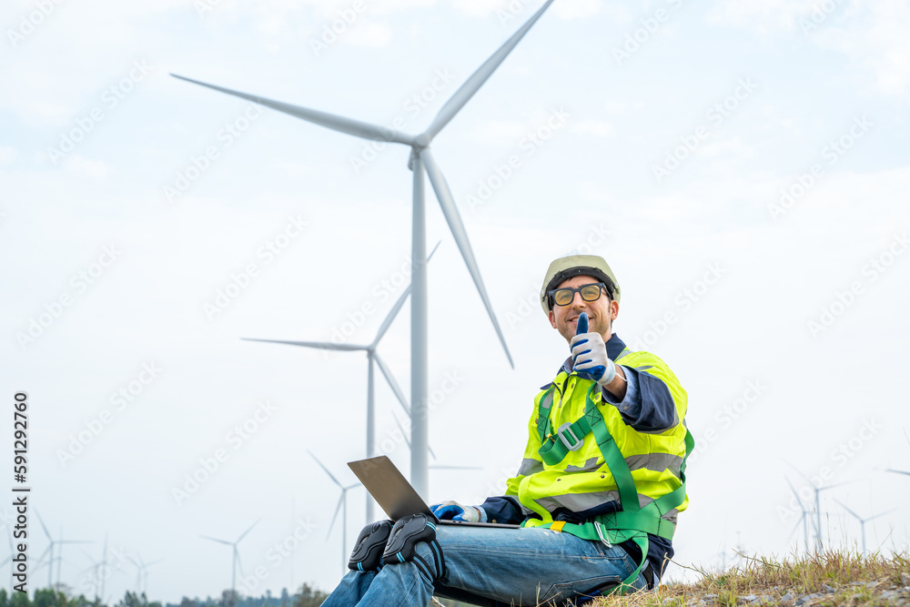 Technician Engineer in uniform are checking wind turbine power farm, Power generator station,Clean e