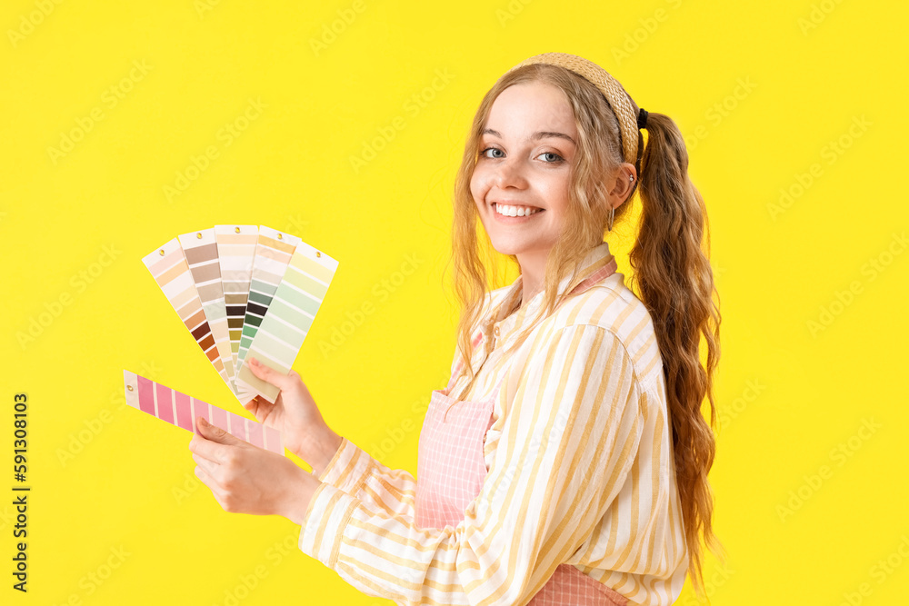 Female artist with paint color palettes on yellow background