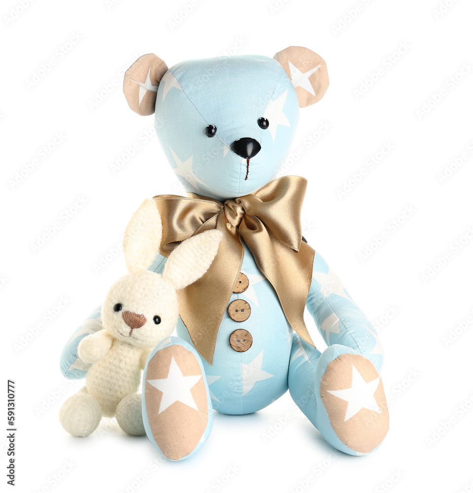 Toy bear and bunny on white background