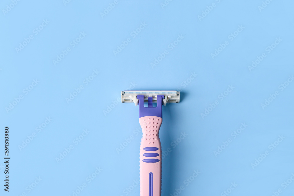 Razor for hair removal on color background