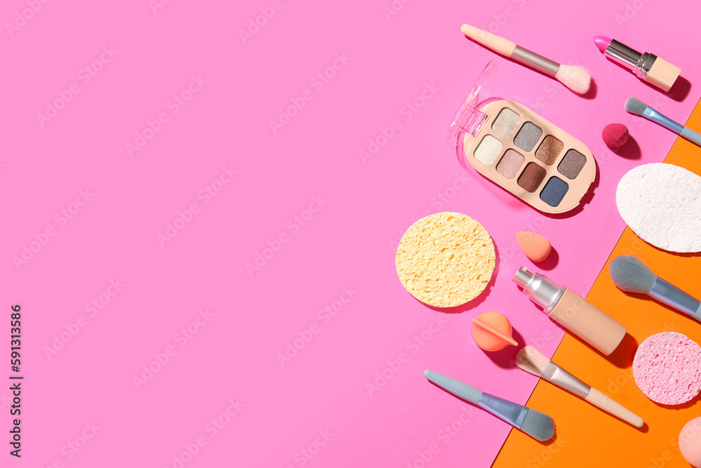 Decorative cosmetics with makeup brushes and sponges on color background