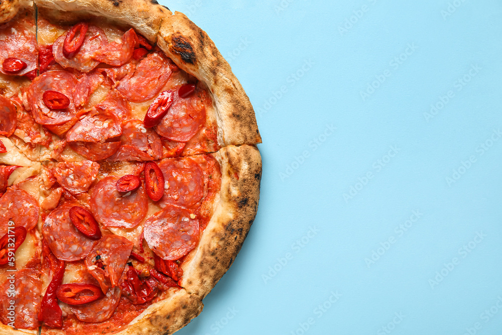 Delicious pepperoni pizza on blue background