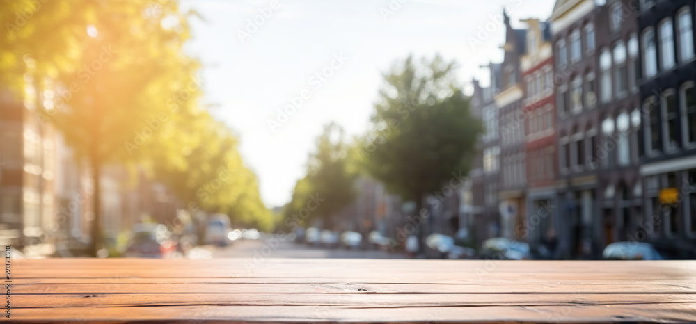 Wood table mockup with Amsterdam city street in shallow depth of field. Copy space for product. Gene