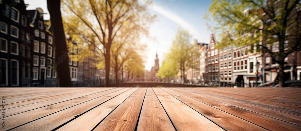 Wood table mockup with Amsterdam city street in shallow depth of field. Copy space for product. Gene