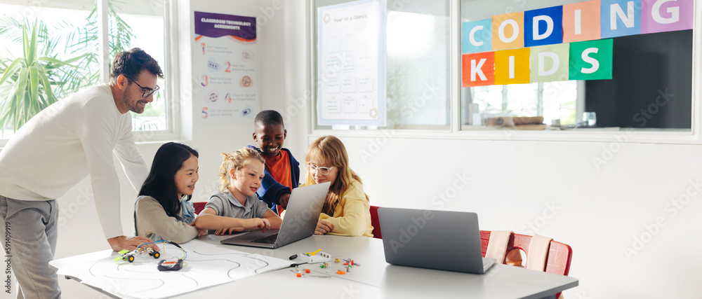 Primary school children learn robot programming with their teachers guidance