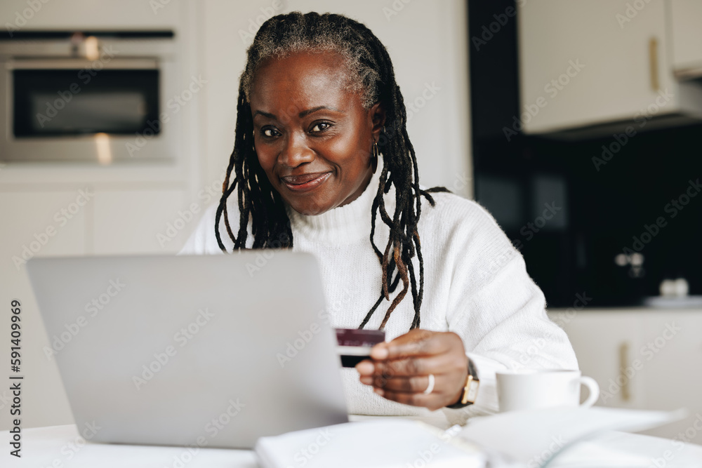 Mature woman shopping online at home