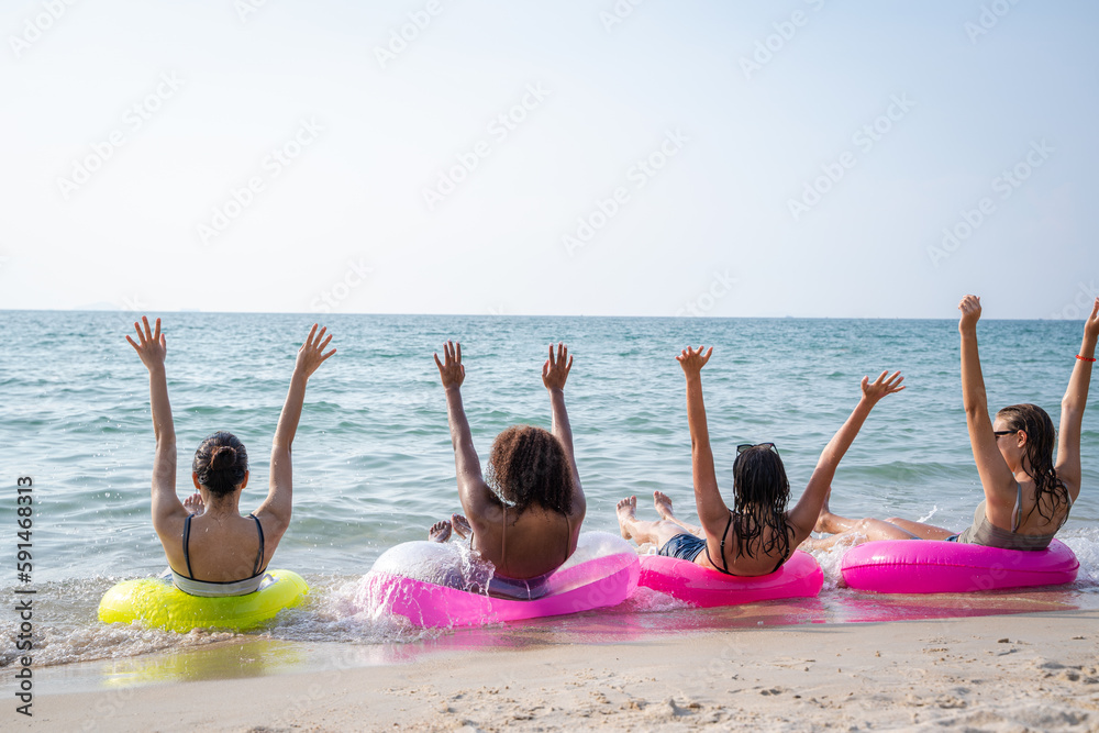 Happy female friends enjoy and fun outdoor activity lifestyle on holiday travel vacation at the sea,