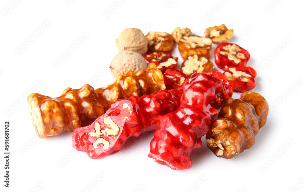 Delicious churchkhela and walnuts isolated on white background