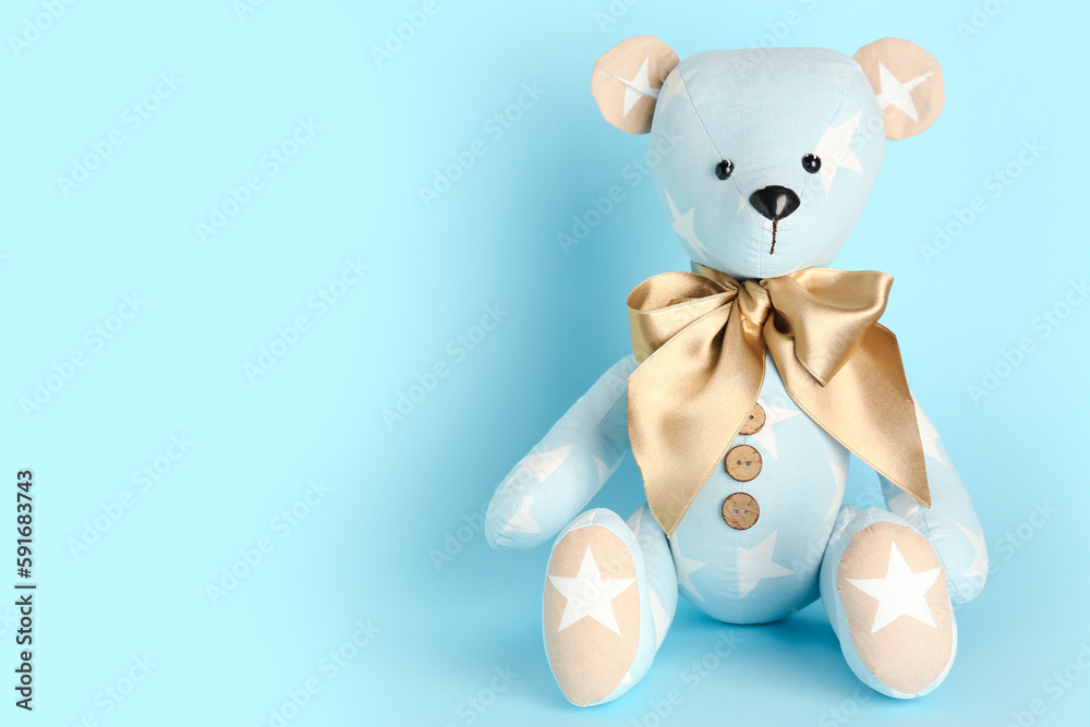 Toy bear on blue background