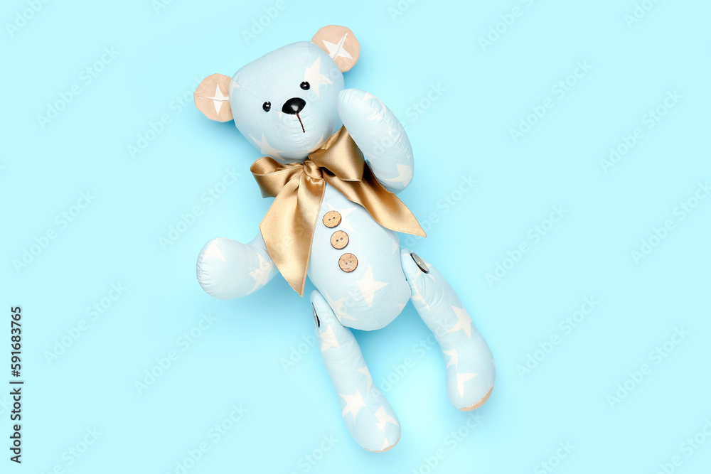 Toy bear on blue background