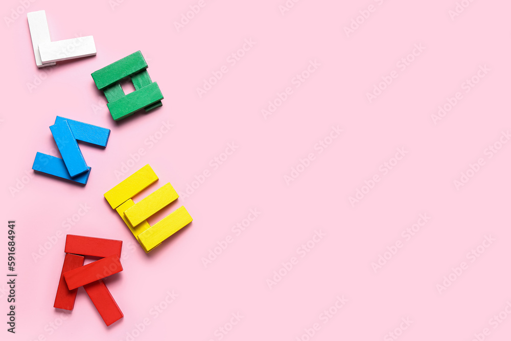 Word LOOSER made of colorful blocks on pink background