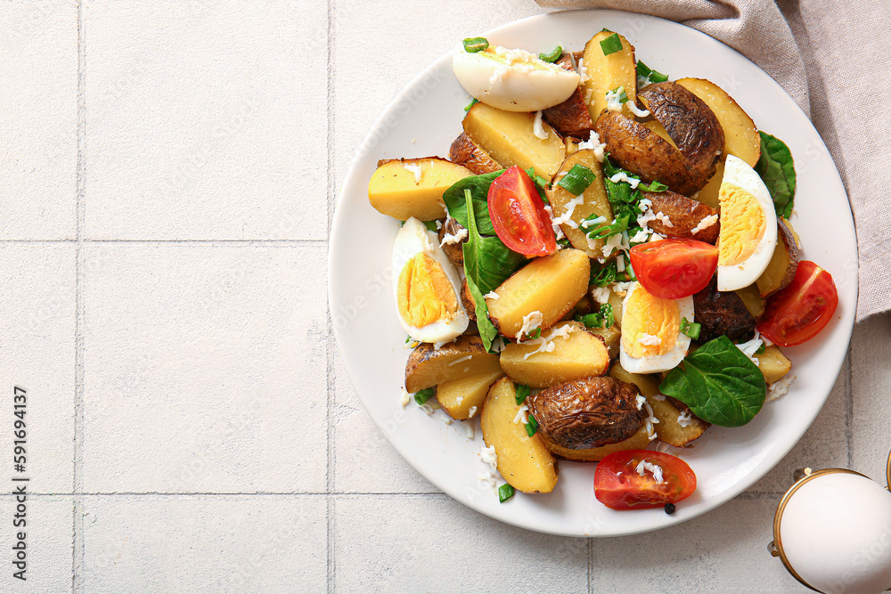 Plate of tasty potato salad with eggs and tomatoes on light background, top view