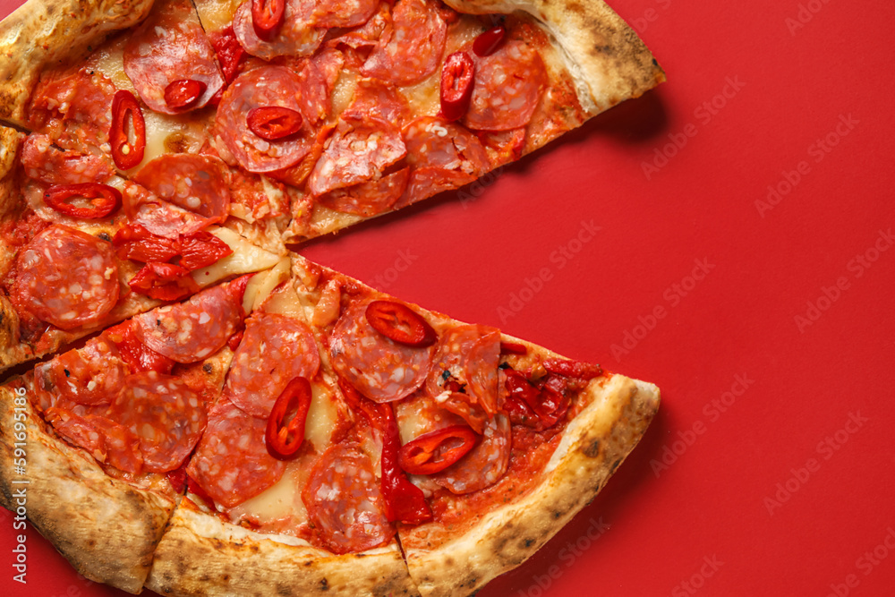 Delicious pepperoni pizza on red background