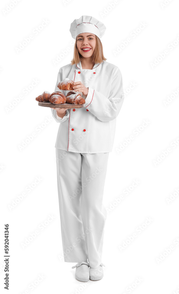 Female baker with board of tasty croissants on white background