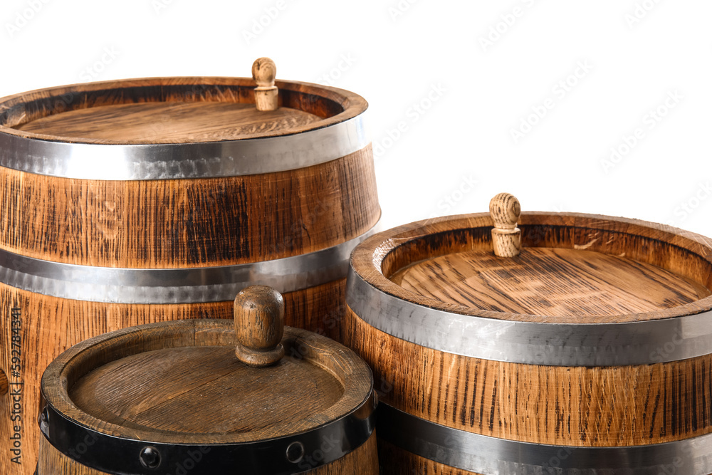 Oak barrels with metal hoops isolated on white background