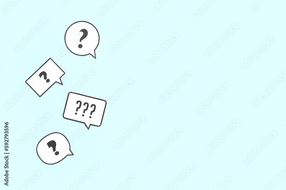 Speech bubbles with question marks on blue background