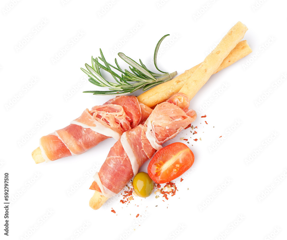 Tasty Italian Grissini with slices of jamon on white background