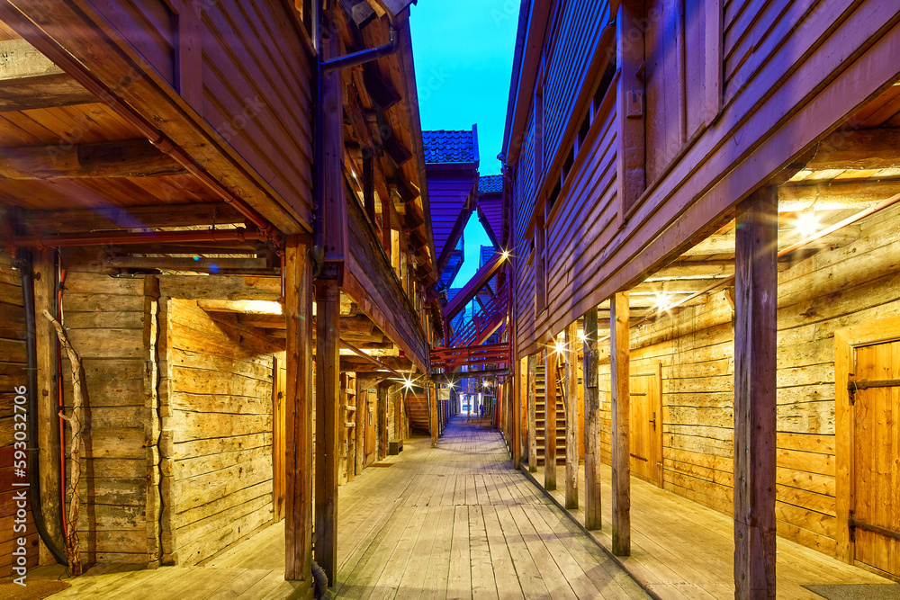 One of the narrow streets in Bryggen at dusk, Bergen, Norway