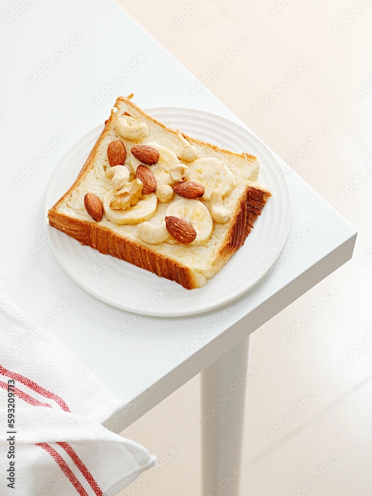 Top view of a Peanut Butter Banana Toast on white table