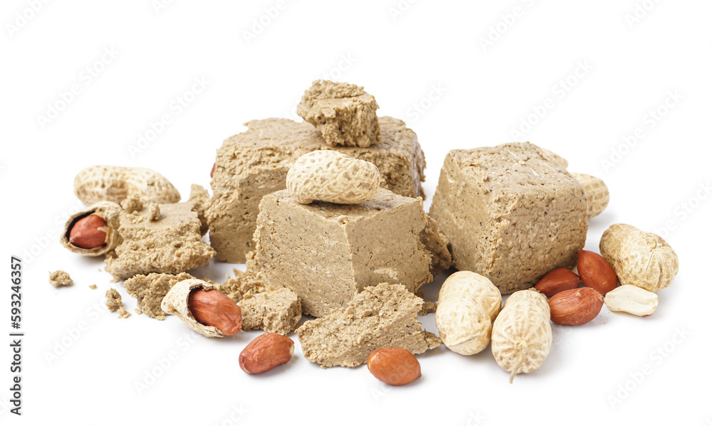 Pieces of sweet halva with peanuts on white background