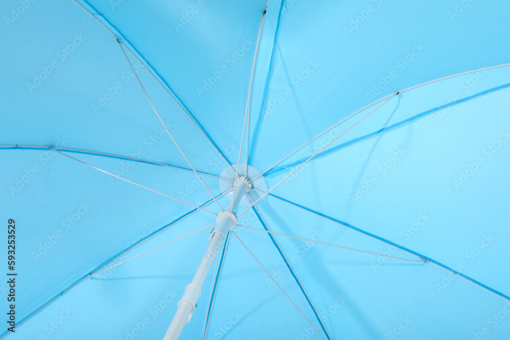 Blue beach umbrella as background