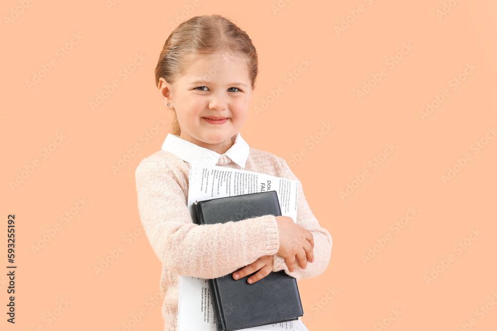 Funny little businesswoman with notebook and newspaper on beige background