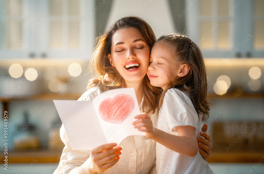 Daughter giving mother postcard.