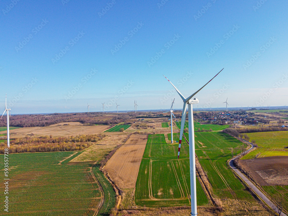 Aerial view of a wind farm in Poland. Renewable sources of electricity. Windmills in the fields. ene