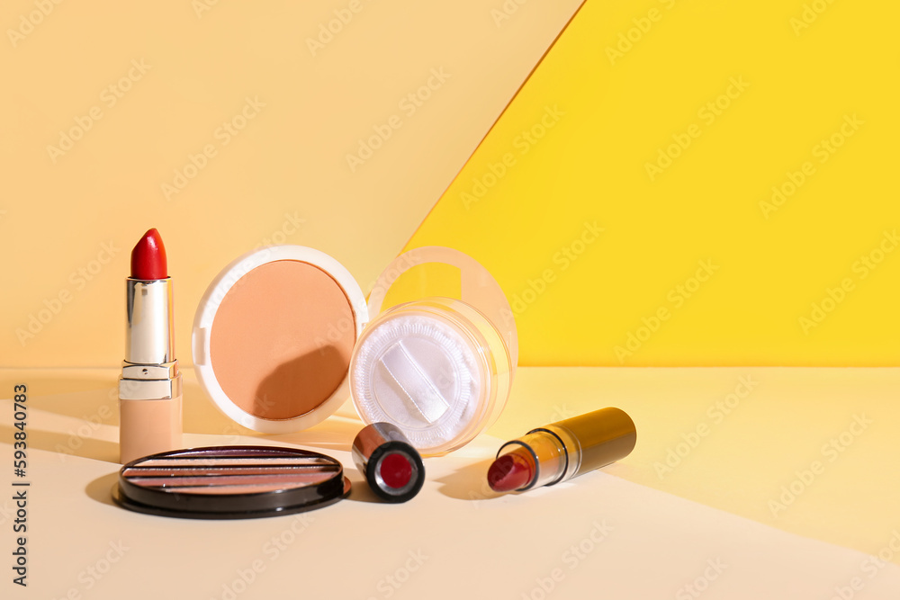 Decorative cosmetics on beige table