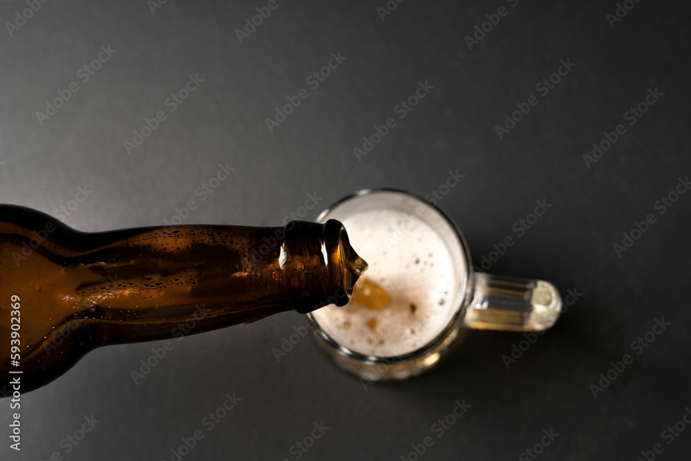 Person pouring beer in a glass