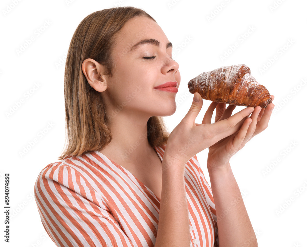 Female baker with tasty croissant on white background, closeup