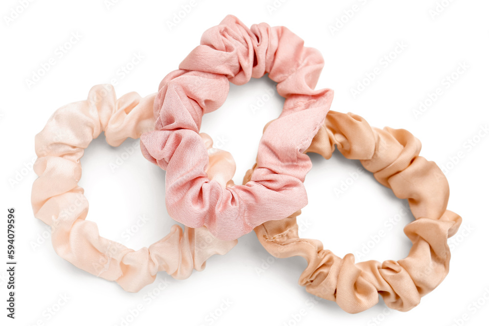 Set of stylish scrunchies on white background