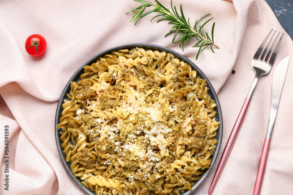 Plate of tasty Italian pasta with Parmesan cheese on table