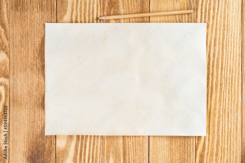 Sheet of paper lying on wooden table