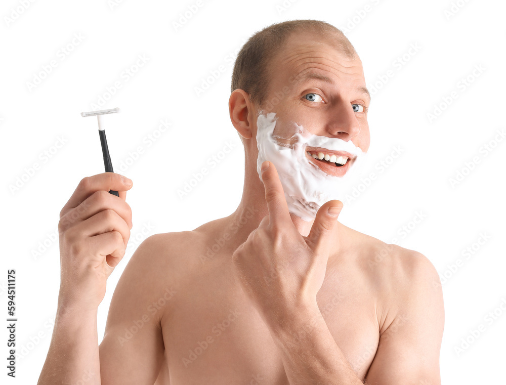 Young man shaving against white background