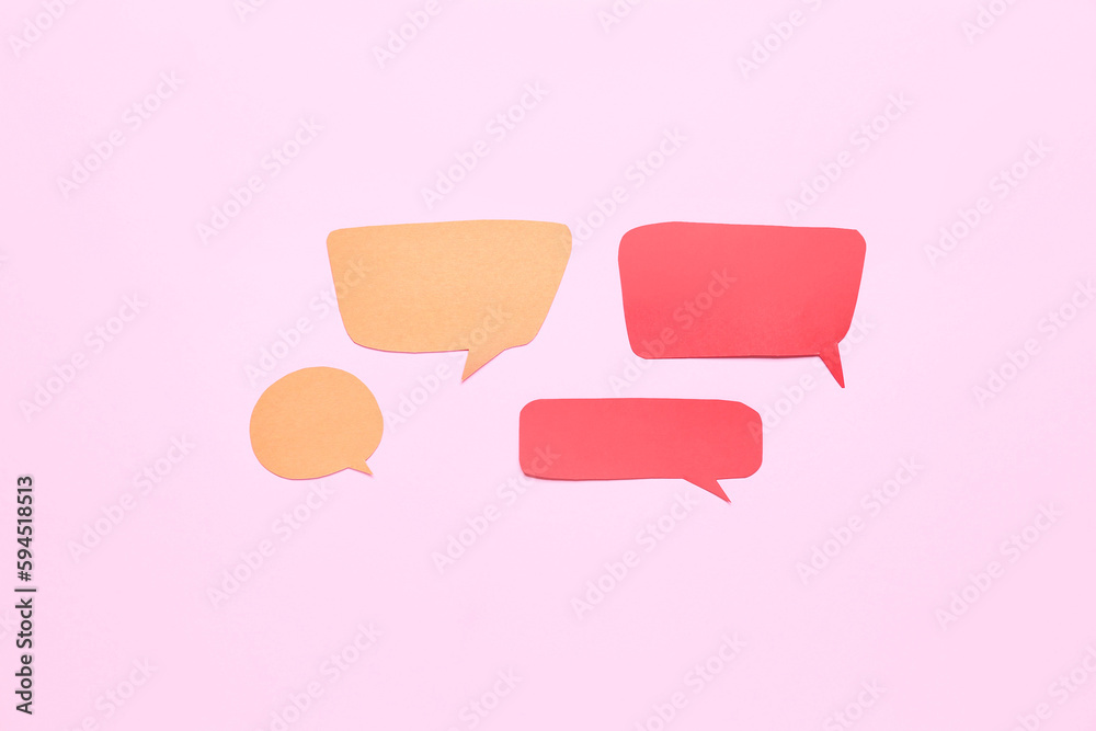 Blank speech bubbles on pink background