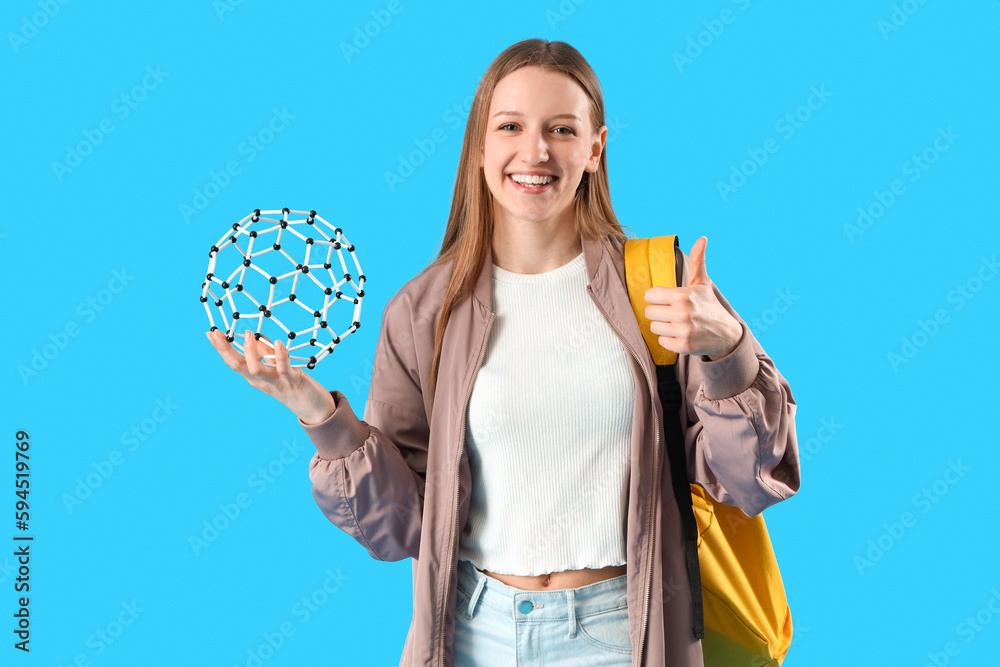 Female student with molecular model  on blue background