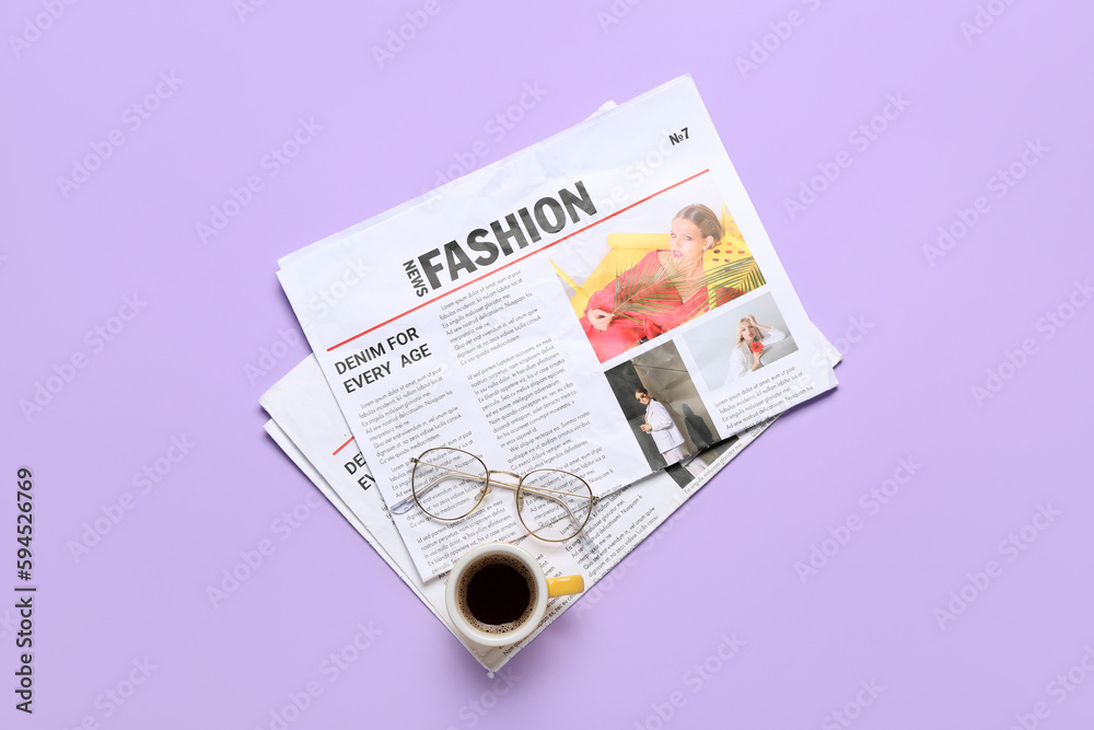 Newspapers with eyeglasses and cup of coffee on lilac background