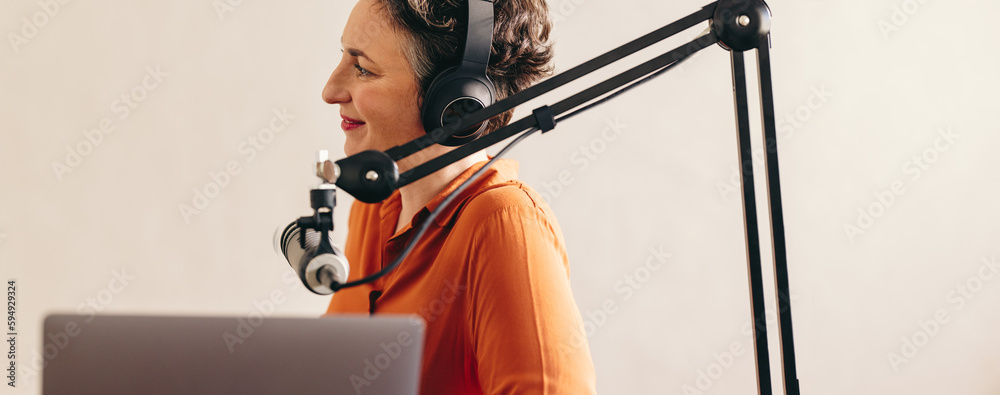 Woman interviewing a guest on her podcast