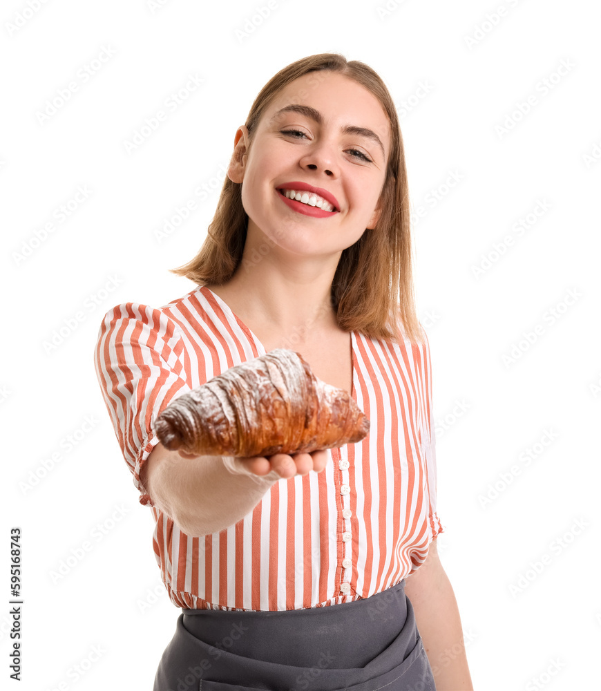 Female baker with tasty croissant on white background