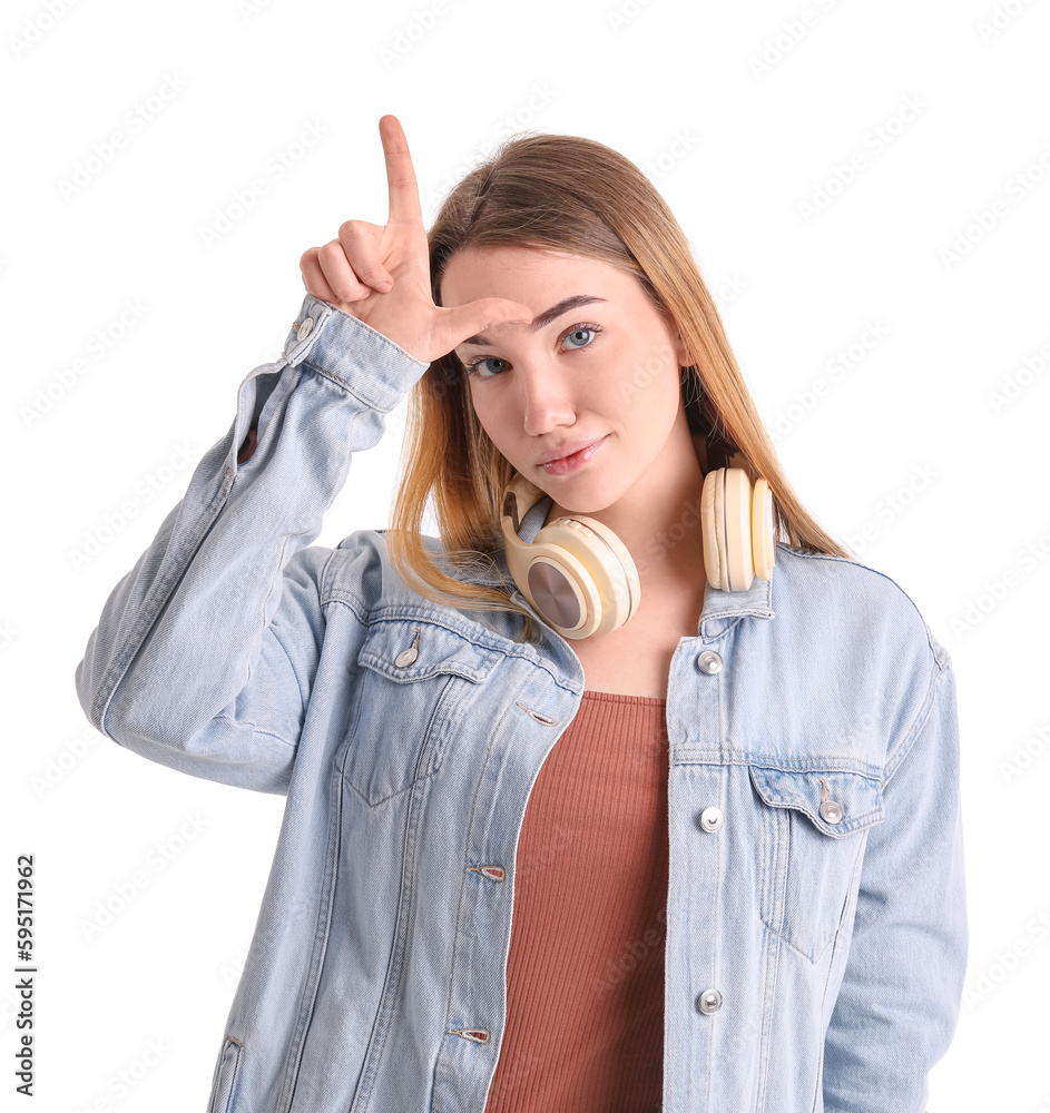 Young woman showing loser gesture on white background