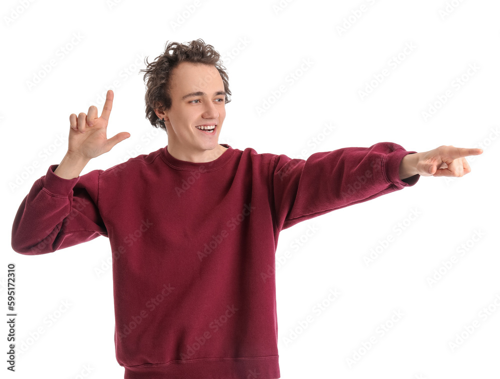 Young man showing loser gesture on white background