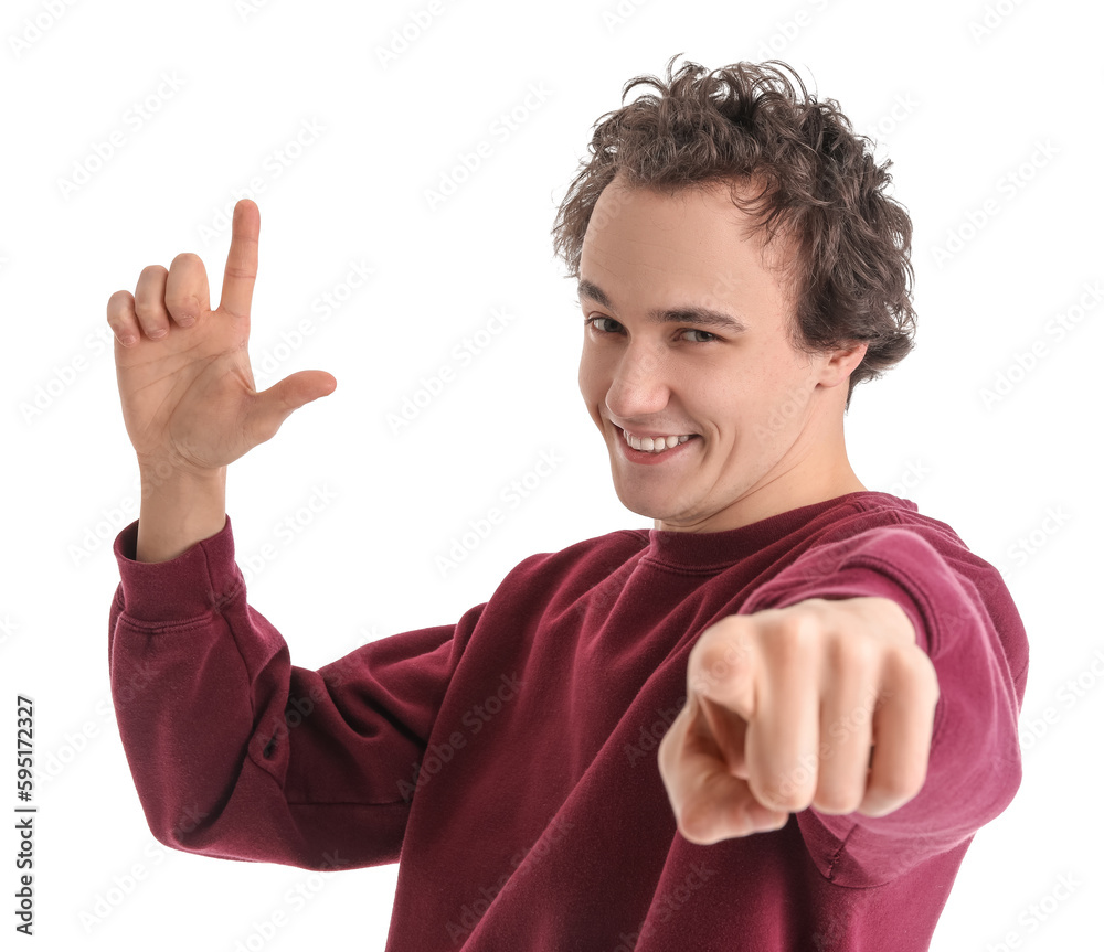 Young man showing loser gesture on white background