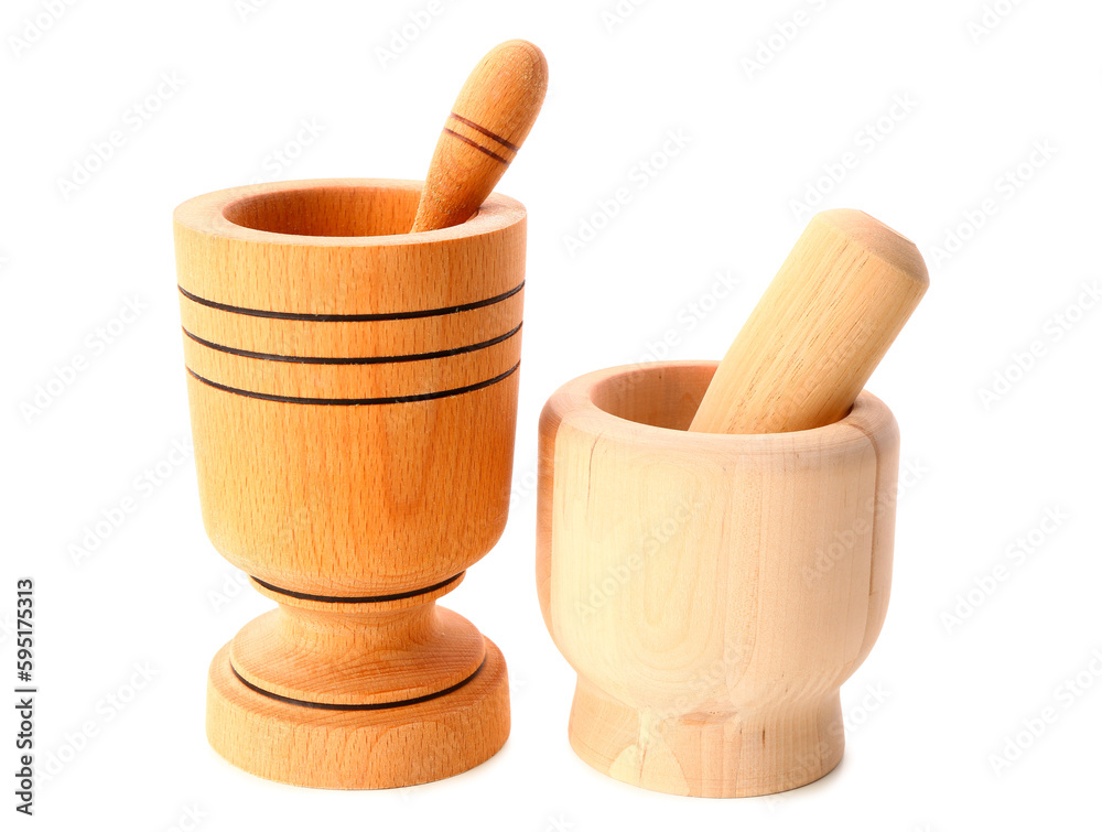 Wooden mortars with pestles isolated on white background