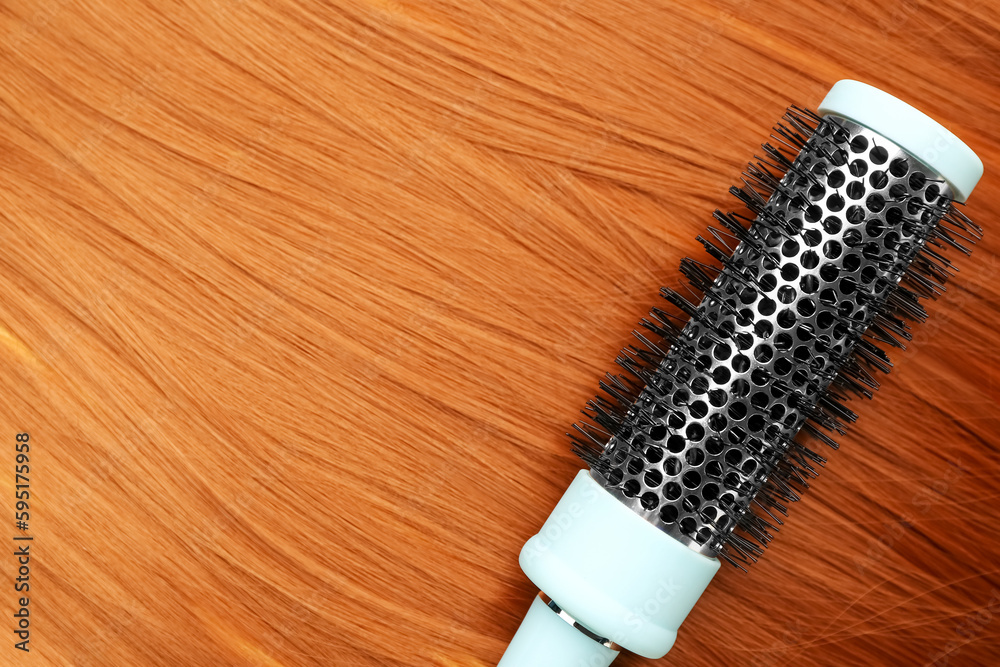 Brush on red hair, closeup